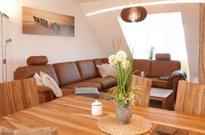 a living room with a couch and a table at Ferienwohnung Baabe Jack Sparrow Ref. 189689-2 in Baabe