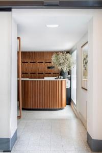 a hallway with a kitchen with a wooden wall at Ayala 63 - THE ARC COLLECTION in Madrid +90 photos