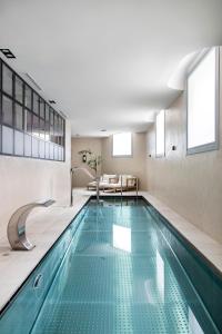 a swimming pool in the middle of a house at Ayala 63 - THE ARC COLLECTION in Madrid