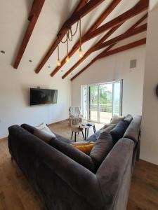 a living room with a large couch and a table at Villa RADA in Igalo