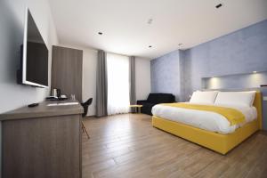 Televízia a/alebo spoločenská miestnosť v ubytovaní Quaint Boutique Hotel Nadur
