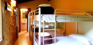 a room with several bunk beds in a room at Recientemente restaurada, ideal para familias! in Cabanellas +31 photos