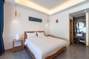 Postel nebo postele na pokoji v ubytování ManBuYunDuan.Theme Inn