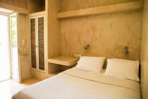 Ένα ή περισσότερα κρεβάτια σε δωμάτιο στο Stavlos Cottage