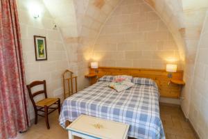 Postel nebo postele na pokoji v ubytování Relais La Giara