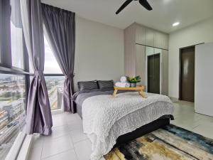 a bedroom with a large bed with purple curtains at 3 Astetica Residences The Mines 4BR WiFi Netflix Lake View in Seri Kembangan