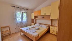 Postel nebo postele na pokoji v ubytování Apartments Gajo
