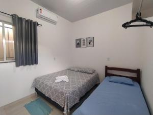 Кровать или кровати в номере Chalé Conforto de Casa