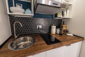 A kitchen or kitchenette at Rione Monti Studio Apt with private garden