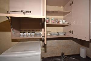 a kitchen with a sink and a counter with dishes at Apartment Koryun 1 in Yerevan +36 photos