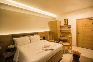 Postel nebo postele na pokoji v ubytování Hotel Ashoka