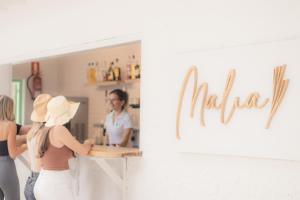 two women standing at a counter in a kitchen at Sol Parc Hotel & Apartments in Son Parc +28 photos