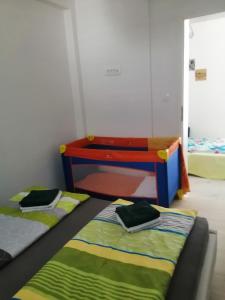 Posteľ alebo postele v izbe v ubytovaní Apartman Marita