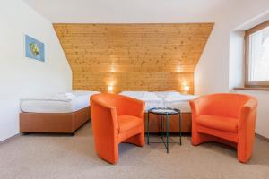 Postel nebo postele na pokoji v ubytování Hotel Rusava