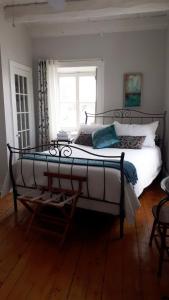 Voodi või voodid majutusasutuse Auberge le Petit Séjour toas
