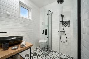 a bathroom with a black sink and a shower at Holiday Park Mandrice in Mandre +37 photos