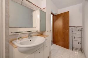 a bathroom with a sink and a mirror at Casa chicken - mare, monti e bikers in Finale Ligure +16 photos