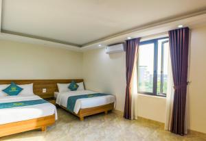 Ένα ή περισσότερα κρεβάτια σε δωμάτιο στο Sunrise Motel +17 φωτογραφίες