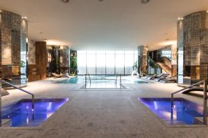 a pool in the middle of a building at Grand Hyatt Barcelona in Barcelona