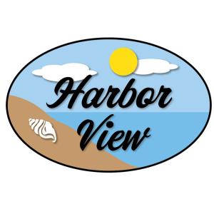 een knop met een strand met de inscriptie harrier virendra bij Harbor View in Karpathos