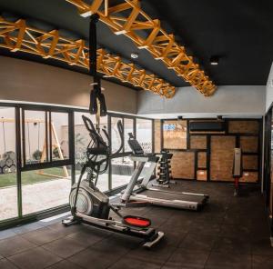 a fitness room with a gym with a treadmill at NEW Department FULL EQUIP in Barranco POOL and GYM in Lima