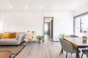 a living room with a couch and a table at Vento Do Mar Apartment by Olala Homes in Cascais