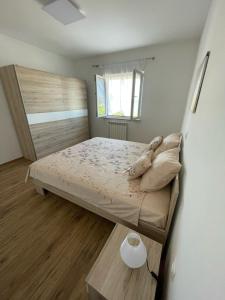 Łóżko lub łóżka w pokoju w obiekcie Apartman Varea