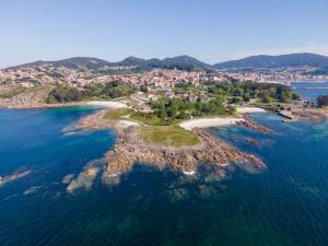 an aerial view of a small island in the water at Casa Airiños do monte in Cangas de Morrazo