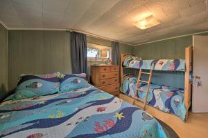 a bedroom with two bunk beds in a room at Pet-Friendly Togus Pond Home Kayak and Canoe! in Augusta
