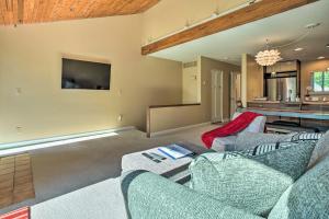 a living room with two couches and a tv at Sunny South Haven Condo Less Than 1 Mi to Beaches! in South Haven