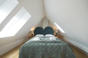 a bedroom with a bed in a attic at Copenhagen Management RA5 in Copenhagen