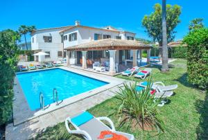 a villa with a swimming pool and a house at Owl Booking Villa Llenaire Gran - 3 min Walk to the Beach in Port de Pollensa