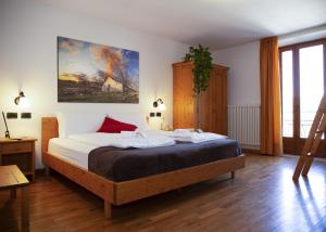 Postel nebo postele na pokoji v ubytování Locanda Alpina a 1250 mt