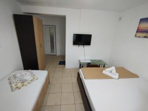 Postel nebo postele na pokoji v ubytování Casa Aura Costinești