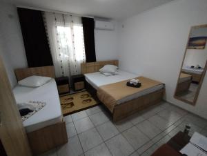 Postel nebo postele na pokoji v ubytování Casa Aura Costinești