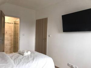 Postel nebo postele na pokoji v ubytování Apartment Diana