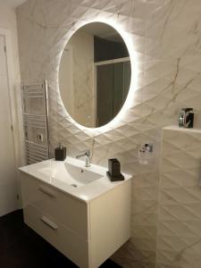 a white bathroom with a sink and a mirror at Atlantic View in Adeje
