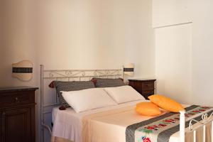 A bed or beds in a room at Agriturismo La Genziana