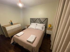 מיטה או מיטות בחדר ב-Departamento completo Surquillo/Miraflores