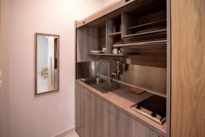 a kitchen with a sink and a counter at Olea Garden Apartments in Stavros