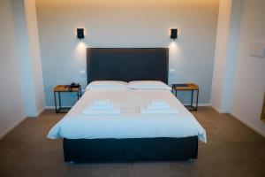 Letto o letti in una camera di Baglio Custera