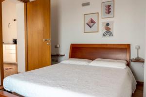 Un pat sau paturi într-o cameră la B&B Borgo Margherita
