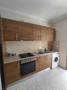 Kuchyňa alebo kuchynka v ubytovaní Konomi Residence-Marilena Apartment