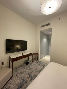 TV at/o entertainment center sa Apartments with three bedrooms at address hotel
