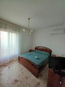 Posteľ alebo postele v izbe v ubytovaní Casa vacanze Blu Taormina