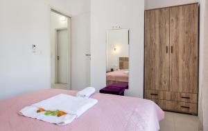 A bed or beds in a room at AVGOUSTIDIS APARTMENTS