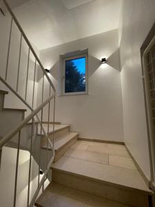 a staircase in a house with a window at Hotel Rüttenscheider Stern in Essen