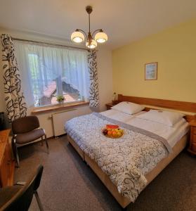 Postel nebo postele na pokoji v ubytování Hotel Karkonosze