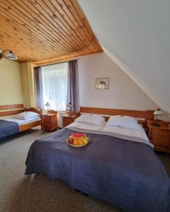 Postel nebo postele na pokoji v ubytování Hotel Karkonosze