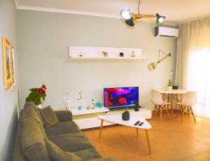 Televízia a/alebo spoločenská miestnosť v ubytovaní LILA apartments 1